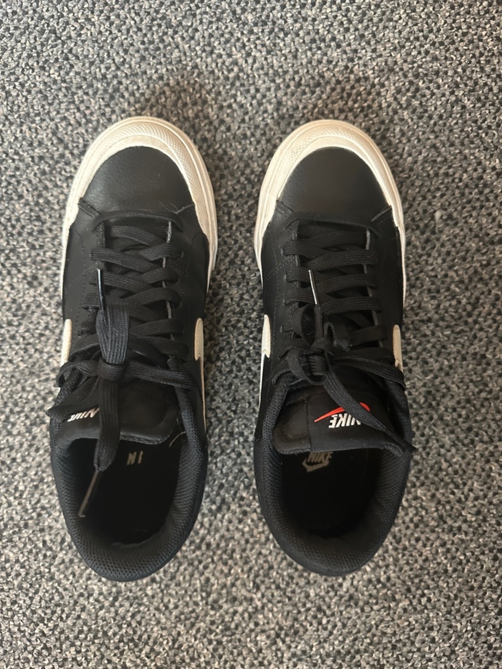 Nike Black Low-Top Sneakers with White Swoosh and Off-White Soles